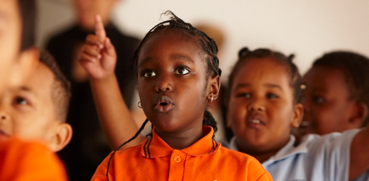 Primary School Students enjoying arts learning lesson in music